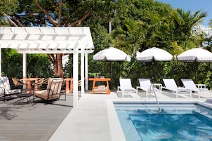 Outdoor pool, open 8:00 AM to 10:00 PM, sun loungers