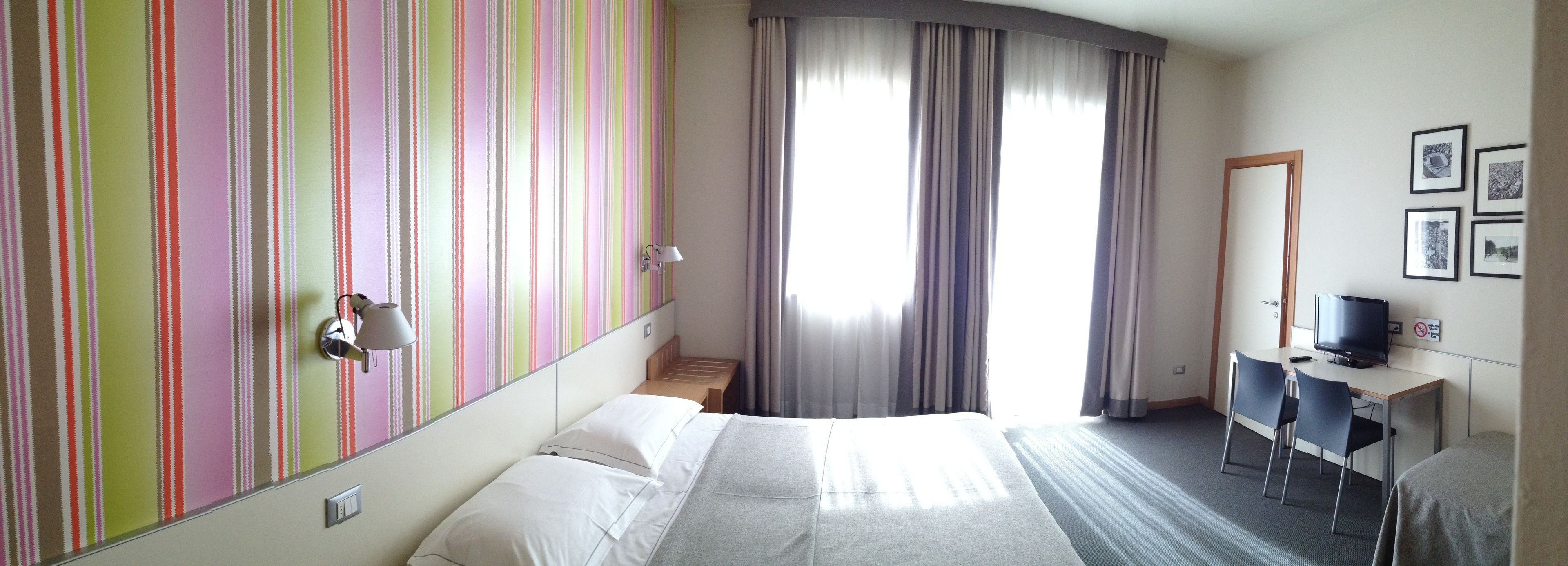 standard double room, 1 king bed | in-room safe, individually decorated, desk, blackout curtains