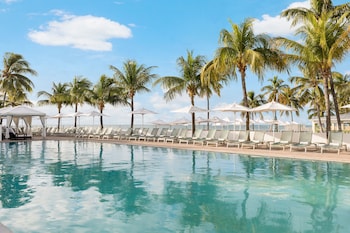 3 outdoor pools, pool umbrellas, sun loungers at Southernmost Beach Resort