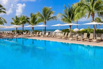 3 outdoor pools, pool umbrellas, sun loungers at Southernmost Beach Resort and Guesthouses