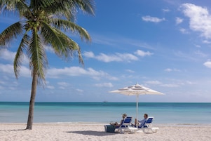 On the beach, sun loungers, beach umbrellas, beach towels
