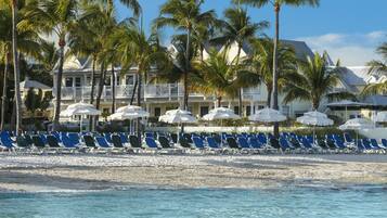 On the beach, sun loungers, beach umbrellas, beach towels