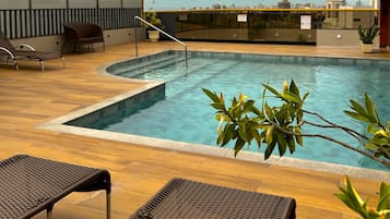 Outdoor pool, open 9:00 AM to 9:00 PM, sun loungers