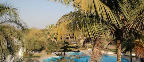 Outdoor pool, open 7:00 AM to 7:00 PM, sun loungers, lifeguards on site