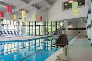 Indoor pool, open 9:00 AM to 10:00 PM, pool umbrellas, pool loungers