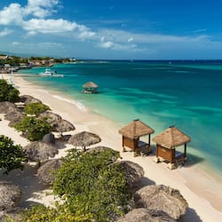 On the beach, white sand, free beach cabanas, sun loungers