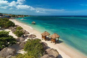On the beach, white sand, free beach cabanas, sun loungers