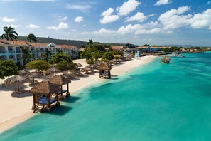 On the beach, white sand, free beach cabanas, sun-loungers