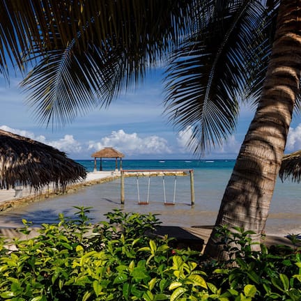 On the beach, white sand, free beach cabanas, sun loungers
