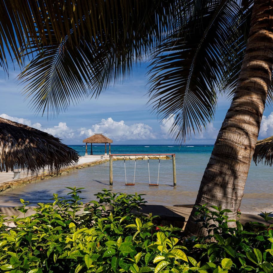 On the beach, white sand, free beach cabanas, sun loungers