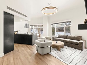 Deluxe Penthouse | Living area | 27-inch LCD TV with cable channels, TV