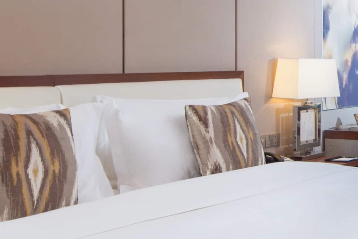 Habitación clásica | Edredón, camas con pillow-top y minibar