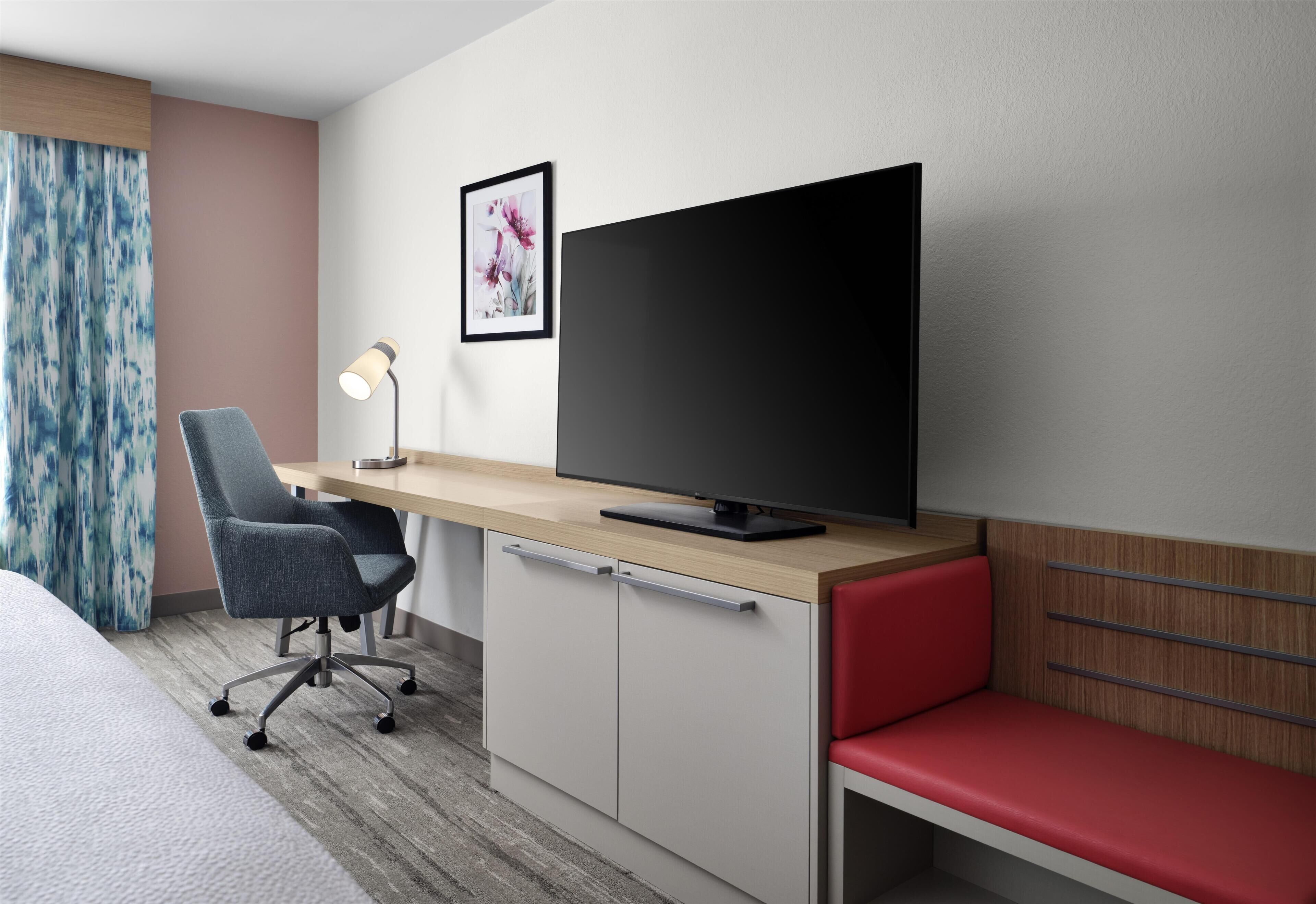 Desk, laptop workspace, blackout drapes, iron/ironing board