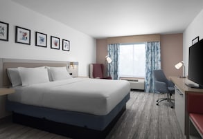 Desk, laptop workspace, blackout drapes, iron/ironing board