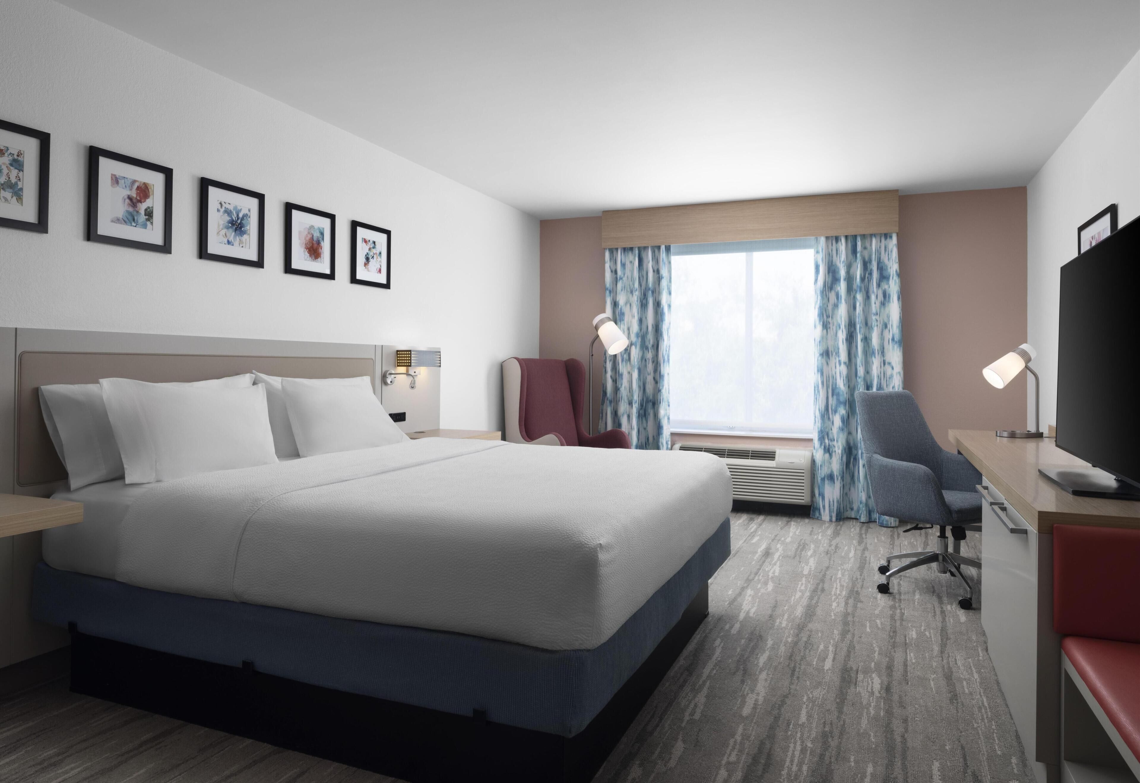 Desk, laptop workspace, blackout drapes, iron/ironing board