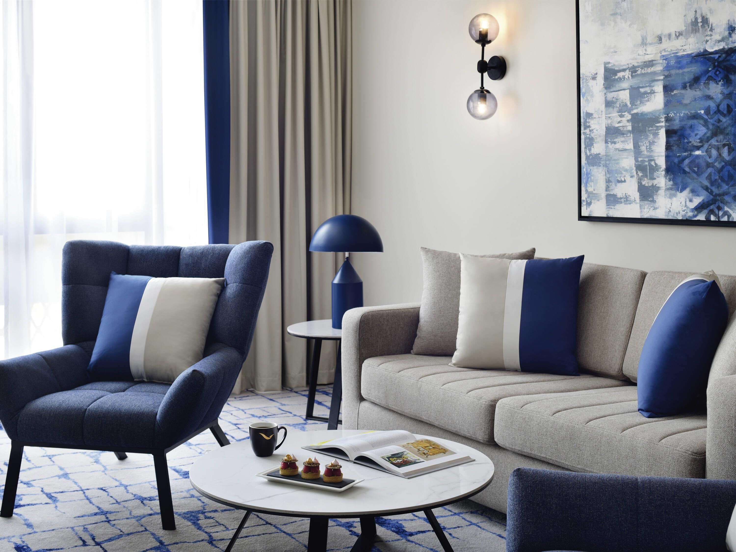 Deluxe Suite, 1 King Bed | In-room safe, desk, laptop workspace, blackout drapes