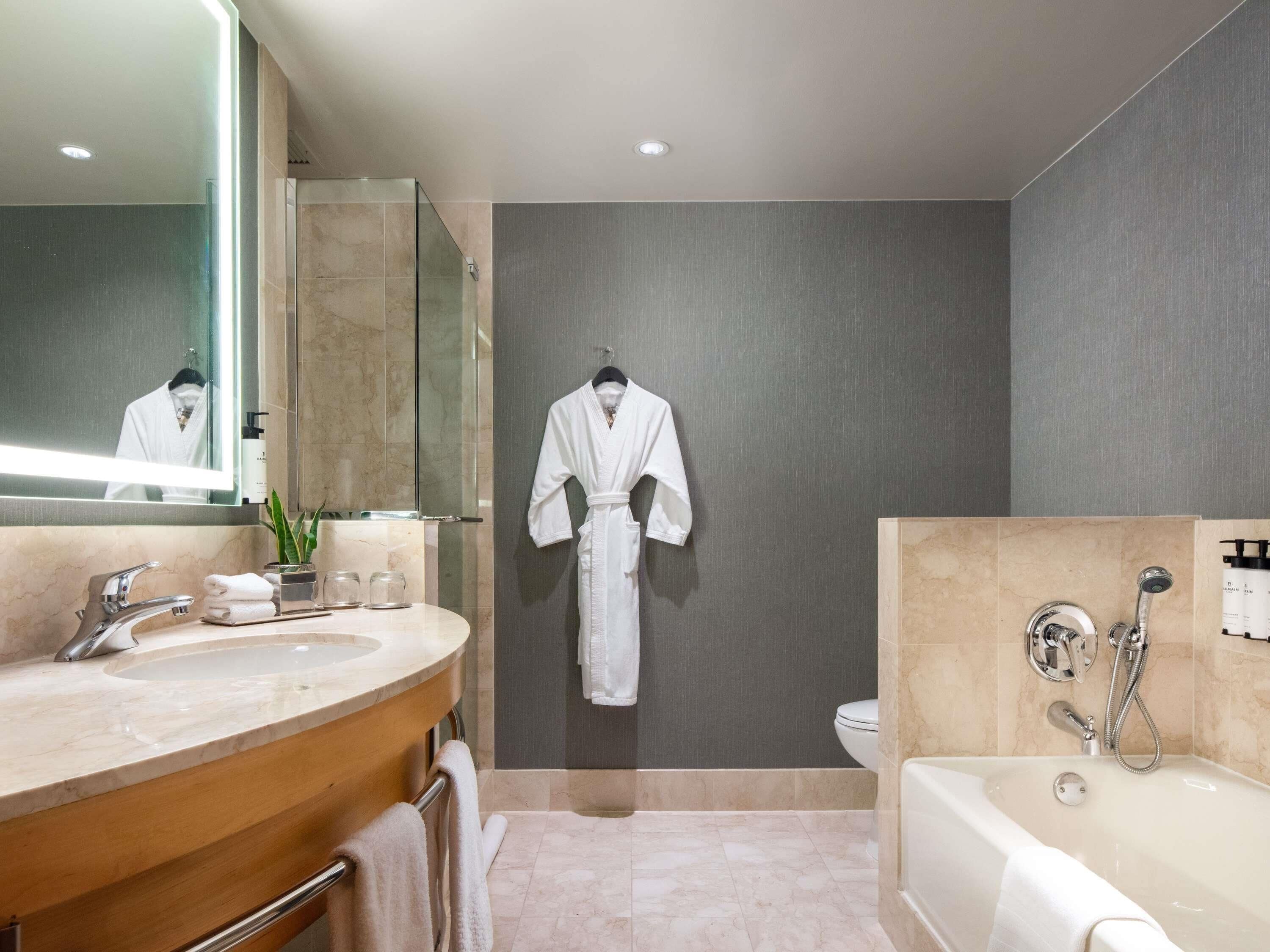 Separate bathtub and shower, designer toiletries, hair dryer, bathrobes