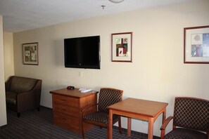Queen Room with 3 Queen Beds Non Smoking | Living area | 42-inch TV with premium channels