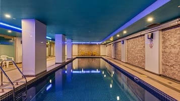 Indoor pool, open 6:00 AM to 9:00 PM, pool loungers