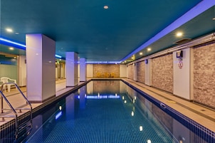 Indoor pool, open 6:00 AM to 9:00 PM, pool loungers