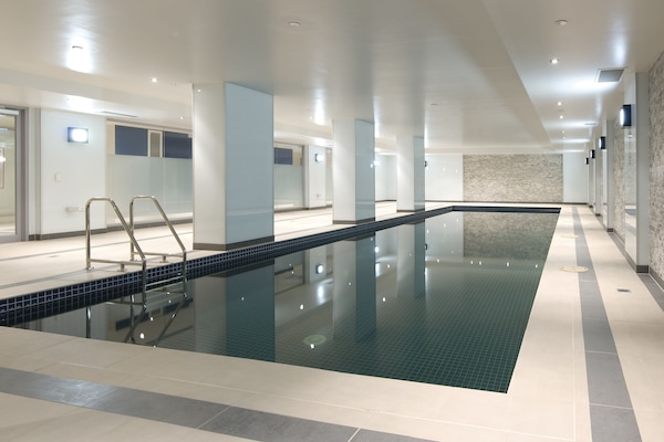 Indoor pool, open 6:00 AM to 9:00 PM, pool loungers