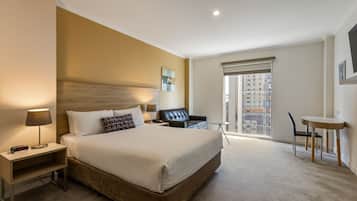 Executive Queen Room (Spencer Street View) | In-room safe, desk, laptop workspace, blackout drapes