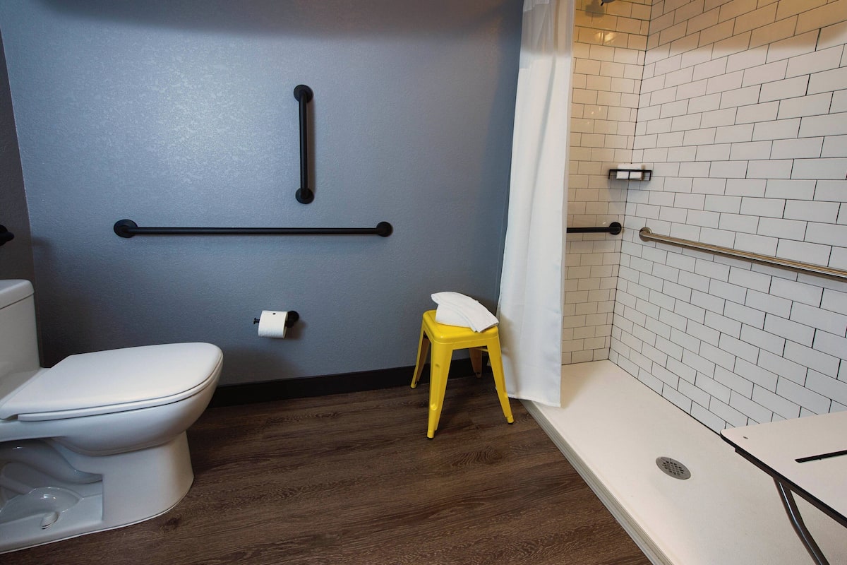 Designer toiletries, hair dryer, towels