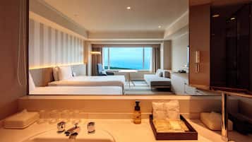 Deluxe Quadruple Room, Multiple Beds, Non Smoking | Bathroom | Combined shower/tub, free toiletries, hair dryer, slippers