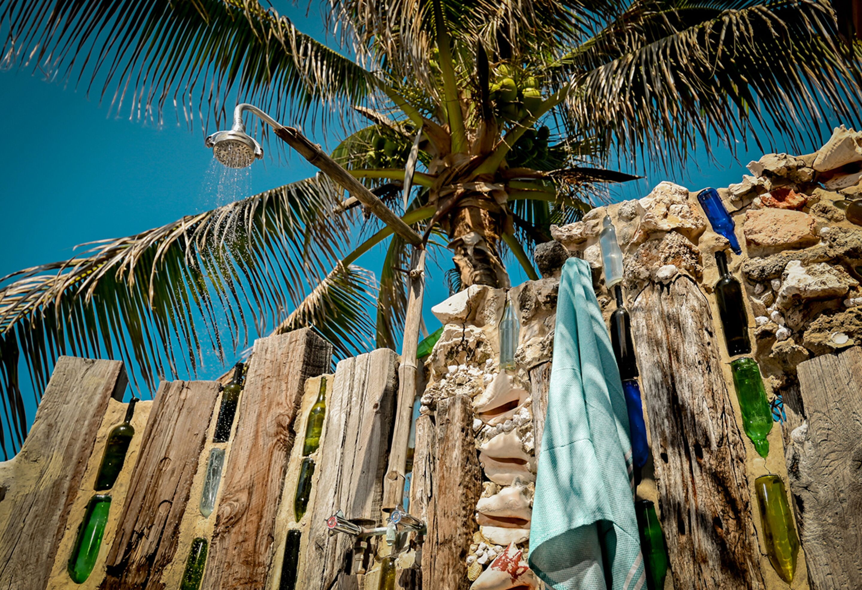 deluxe bungalow, oceanfront | bathroom | combined shower/bathtub, rainfall showerhead, free toiletries