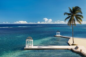 On the beach, white sand, beach cabanas, beach umbrellas