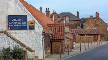 A building with a sign for 'Ancient Mariner Inn' and a 'AA' logo indicating a hotel.