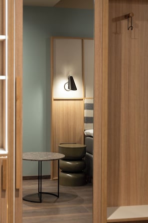 Desk, iron/ironing board, bed sheets