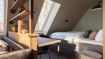 Desk, iron/ironing board, bed sheets