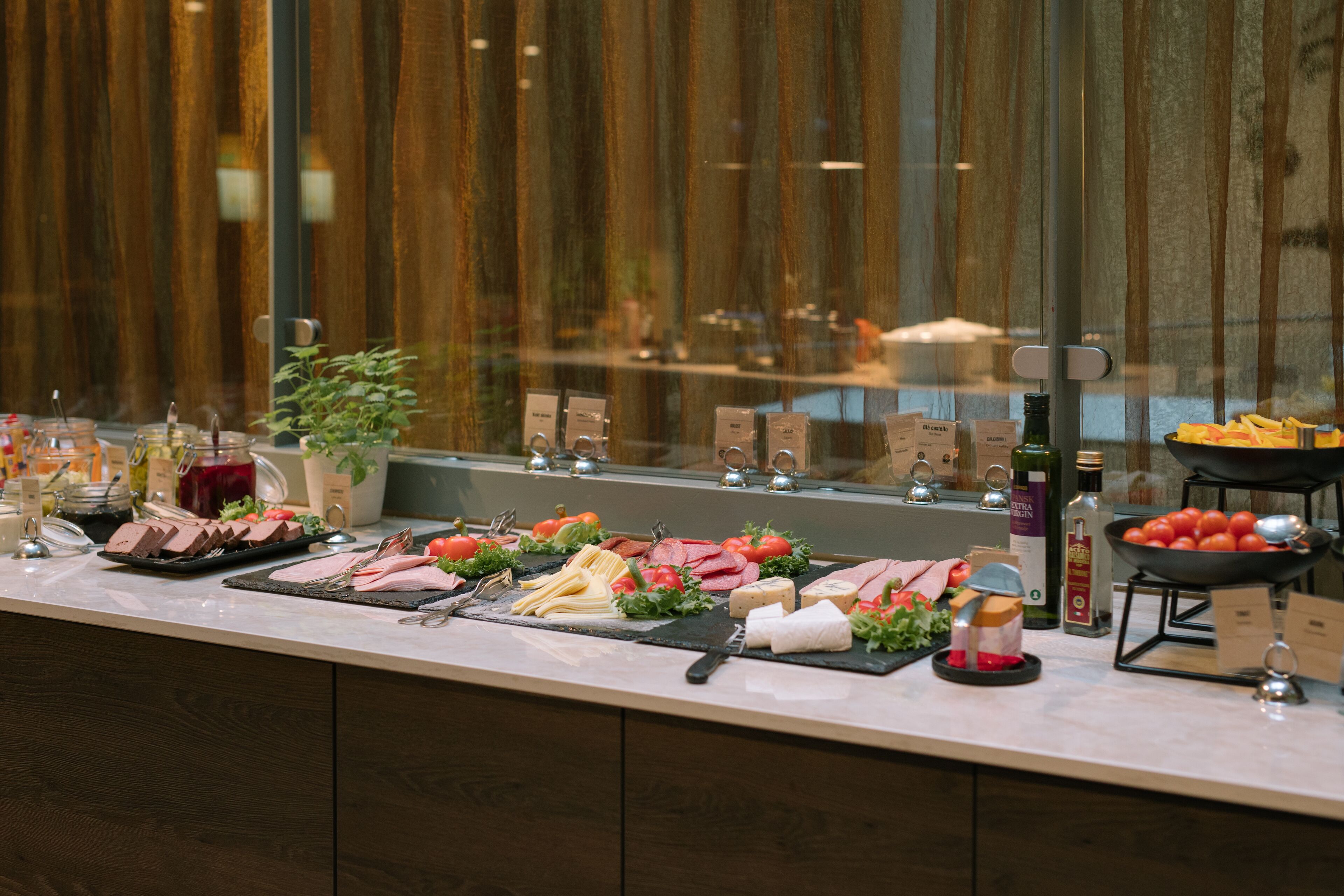 A buffet with various food items and condiments.