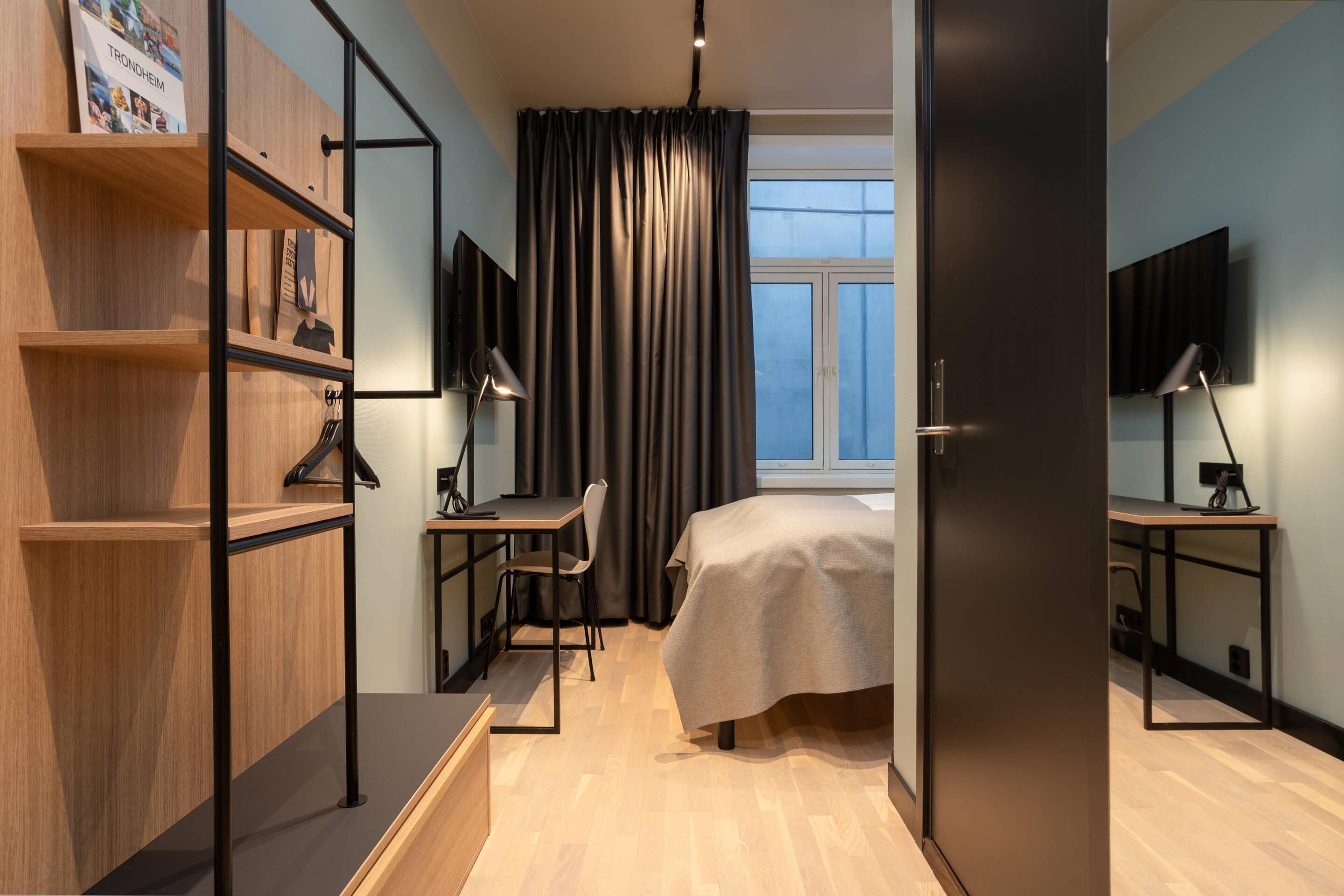 Desk, iron/ironing board, bed sheets