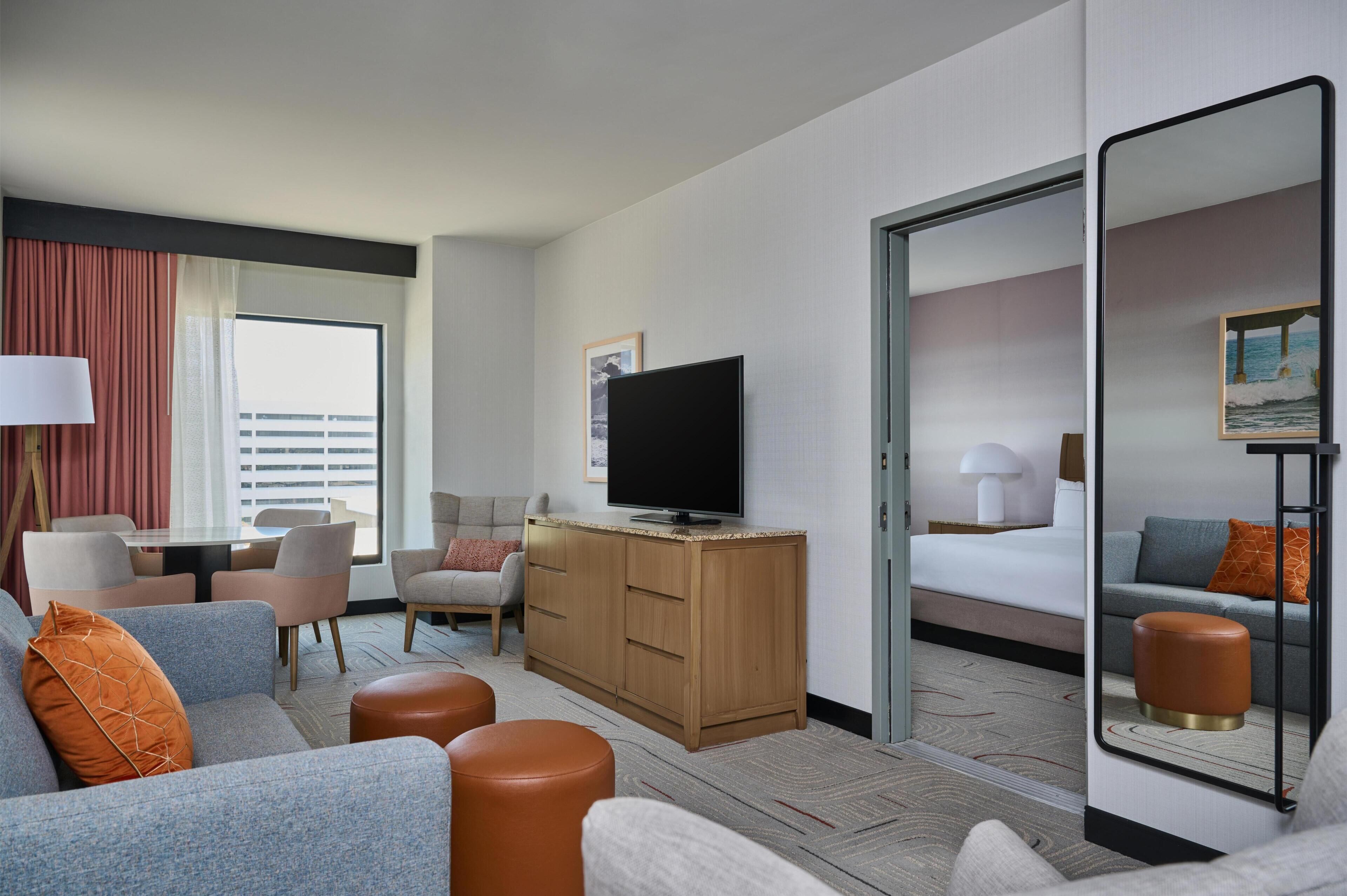 Suite, One King Bed, Non-Smoking | Living area | 55-inch TV with cable channels, streaming services