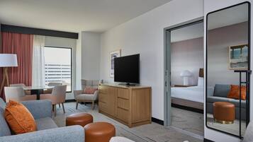 Suite, One King Bed, Non-Smoking | Living area | 55-inch TV with cable channels, streaming services