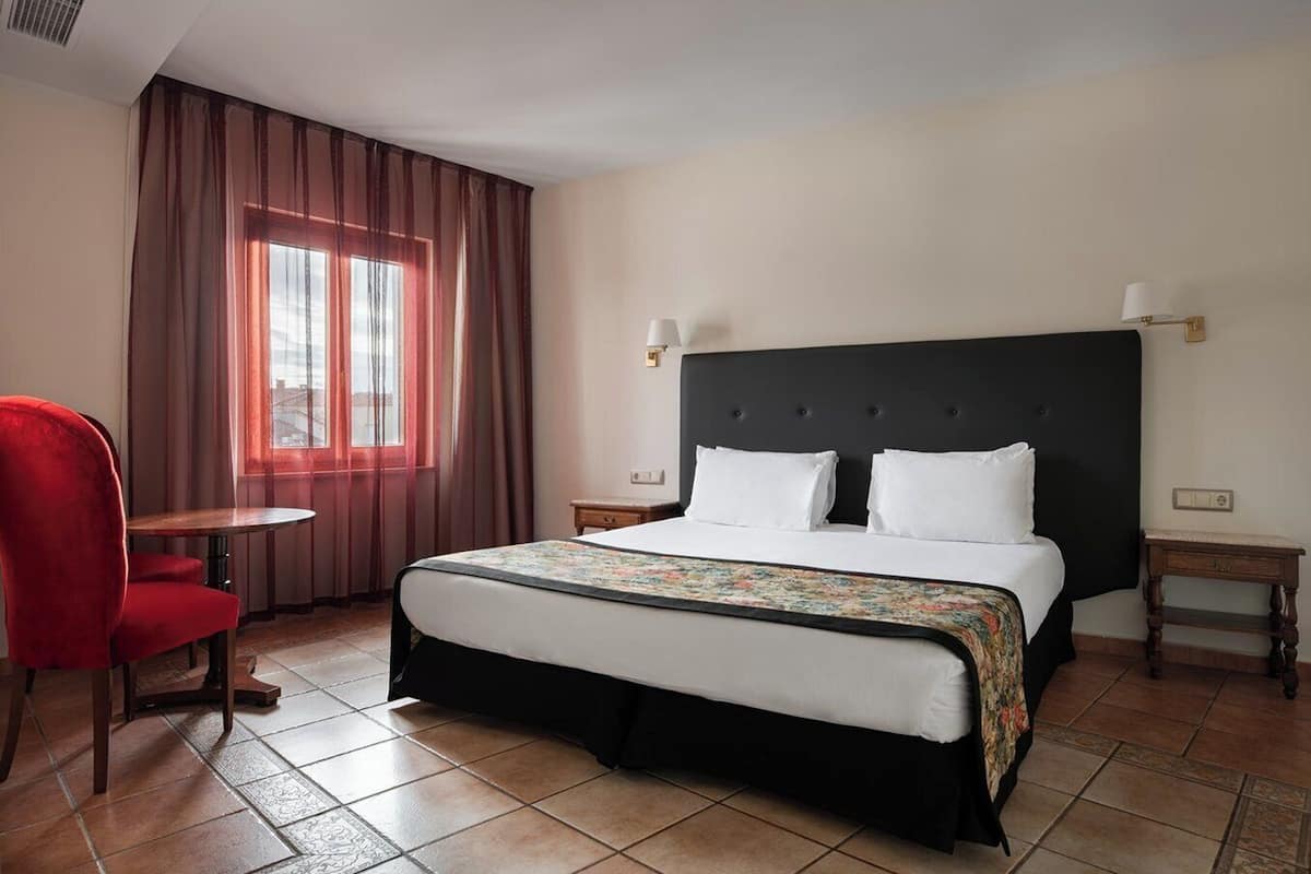 Family Room | Down comforters, minibar, in-room safe, individually furnished