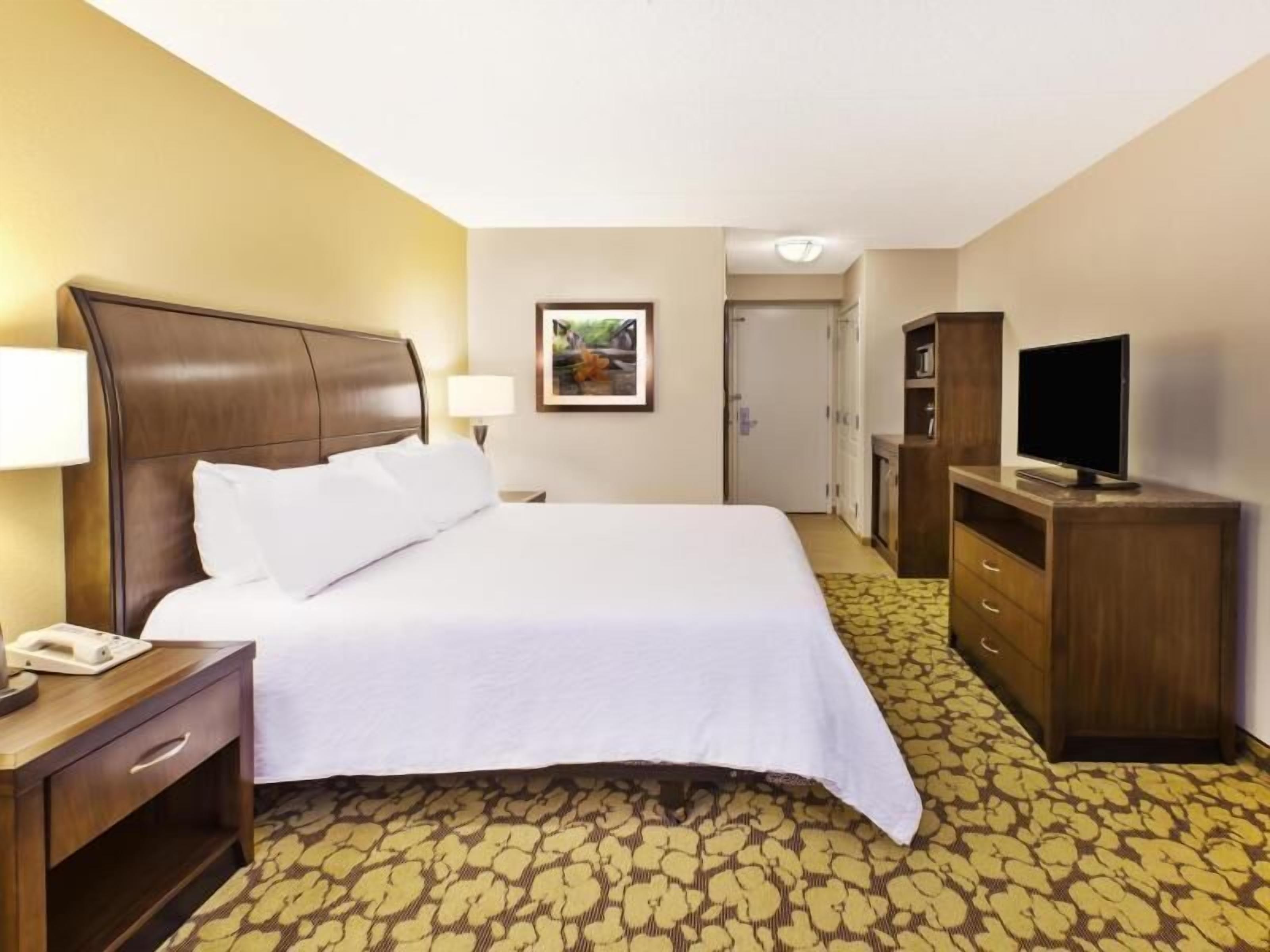 Desk, laptop workspace, blackout drapes, iron/ironing board