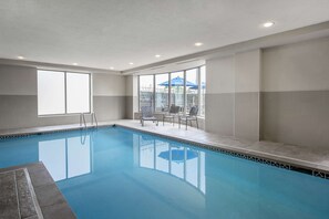 Indoor pool, open 6:00 AM to 11:00 PM, pool loungers