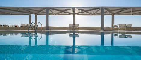 Seasonal outdoor pool, pool umbrellas, sun loungers