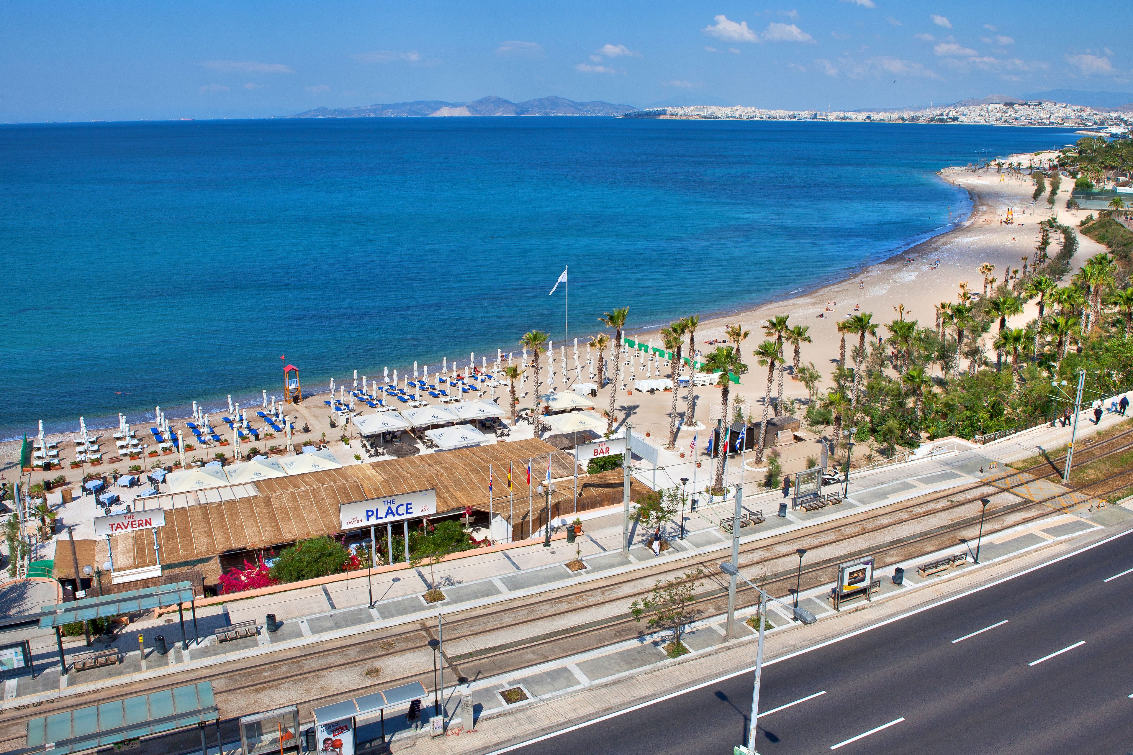 A coastal hotel with a beach view, a bar, and a restaurant.