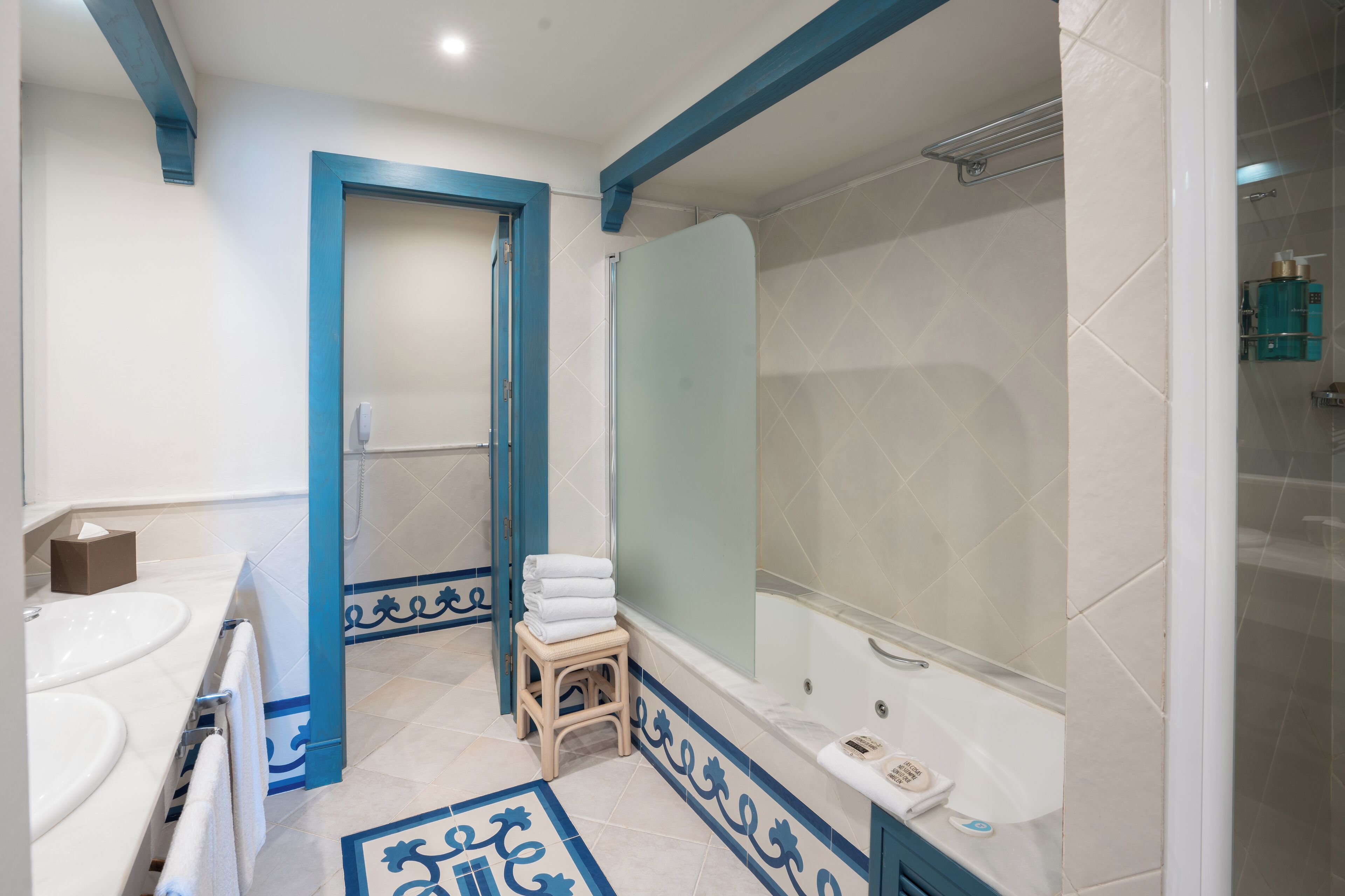 A bathroom with a bathtub, a shower, and a toilet.