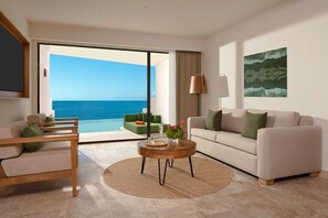 Club Master Suite Ocean Front Swim Out King | Woonkamer | Een 50-inch ledtelevisie met kabelzenders en een televisie