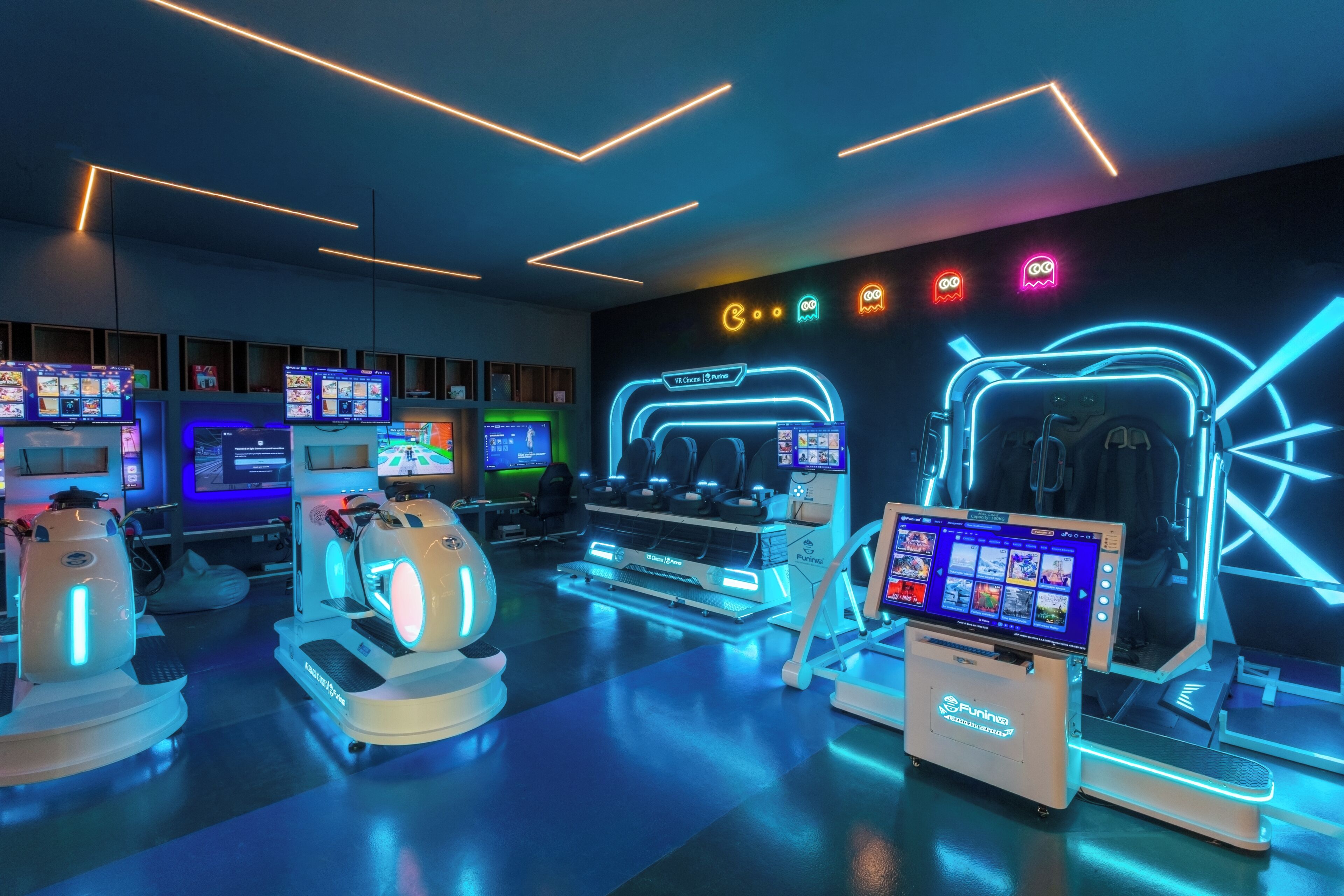 A VR gaming room with multiple VR headsets, a console, and neon signage.