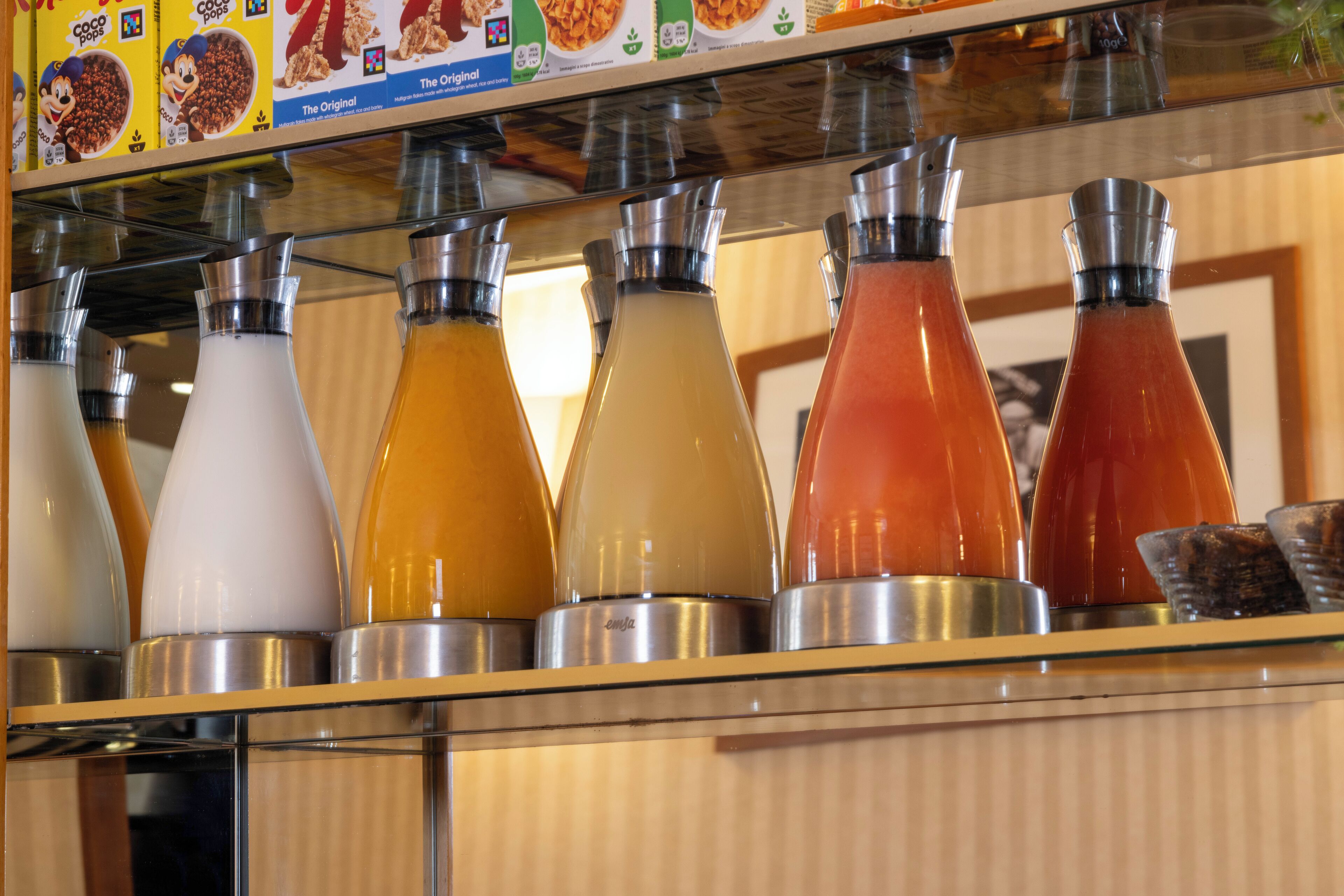 A beverage dispenser with multiple colored drinks.