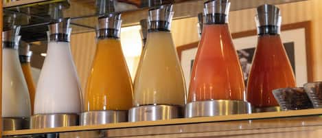 A beverage dispenser with multiple colored drinks.