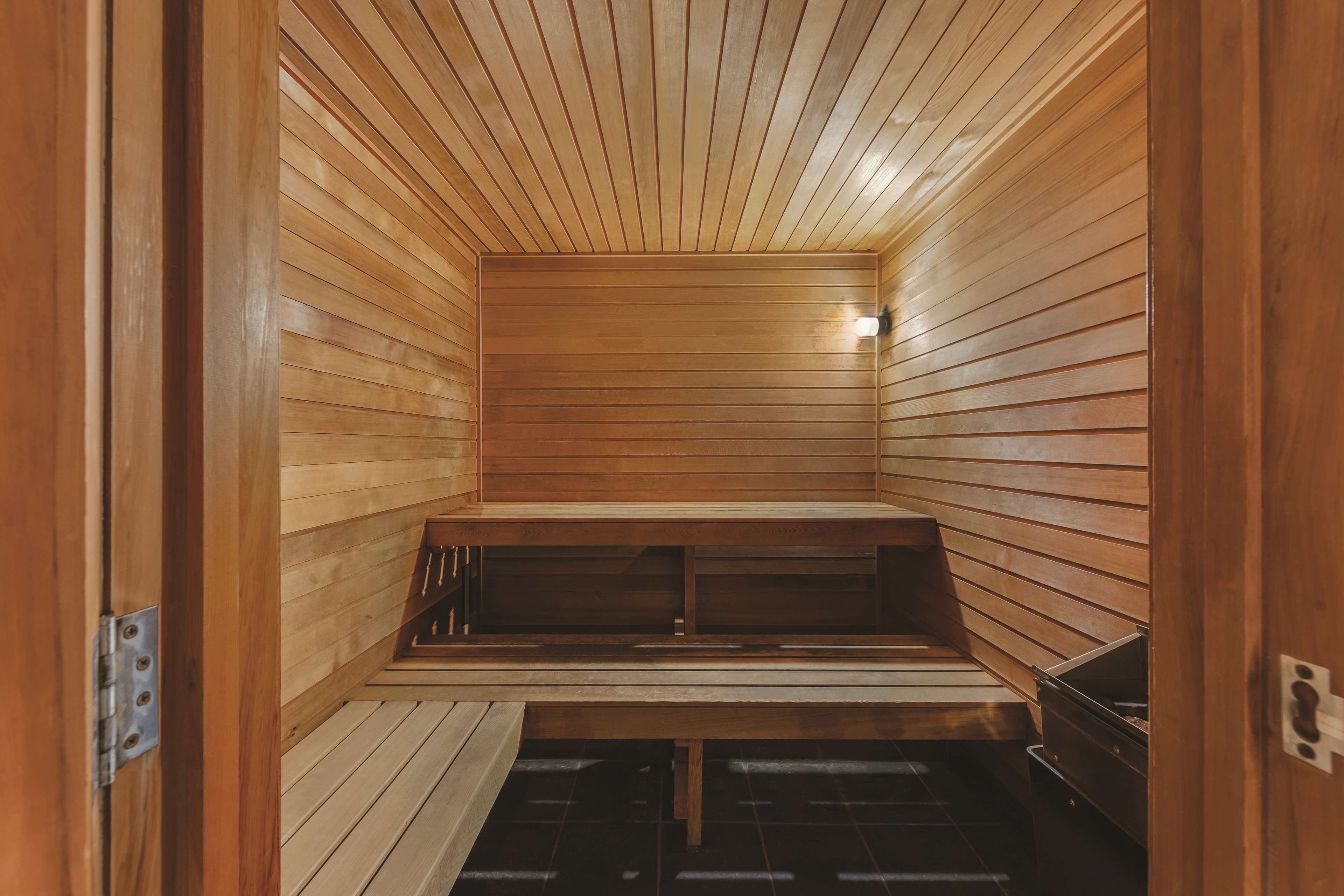 A sauna with wooden walls and benches.