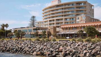 Experience the hotel's stunning views from each floor's balconies, overlooking the surrounding area and the nearby body of water.