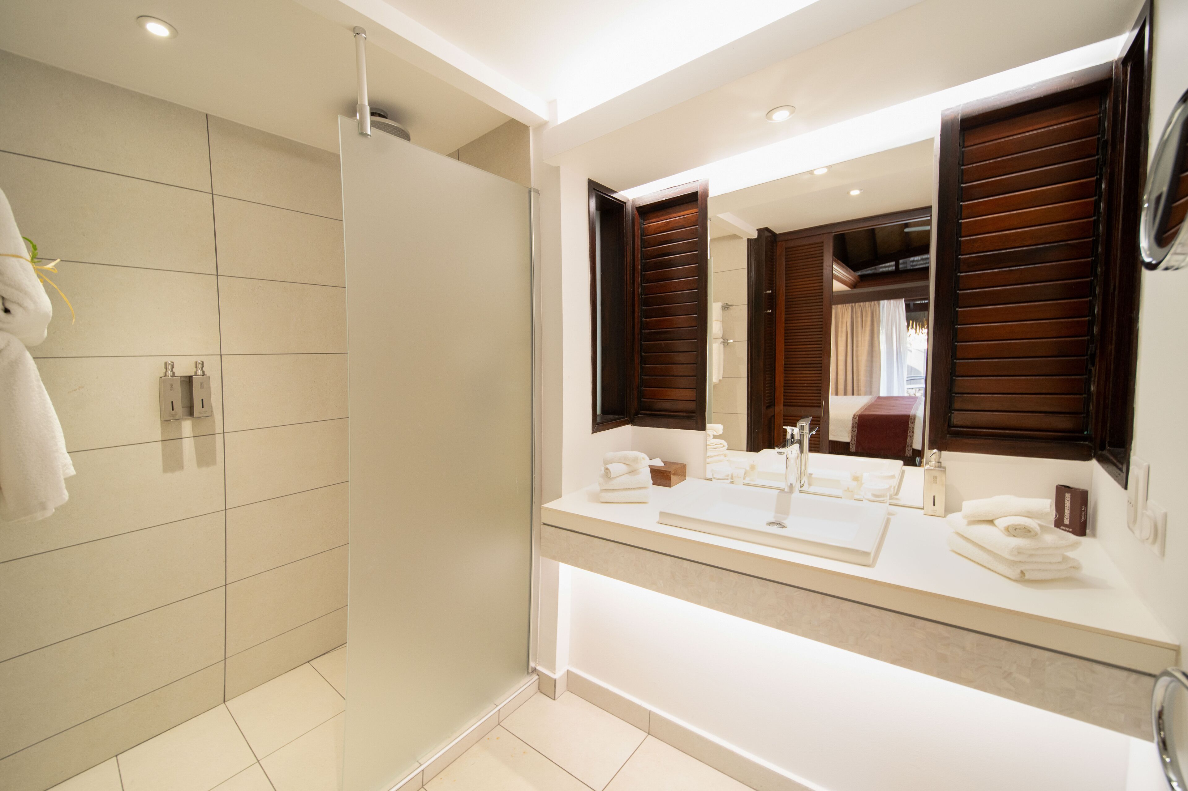 designer toiletries, hair dryer, bathrobes, towels